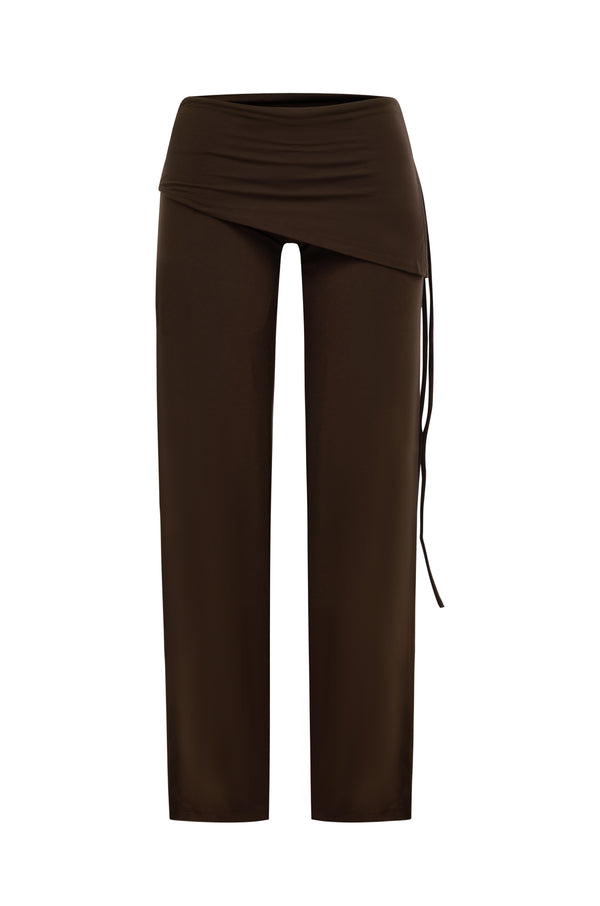 A pair of dark brown pants with an asymmetrical wrap-style waist and a side drawstring, shown against a plain white background.