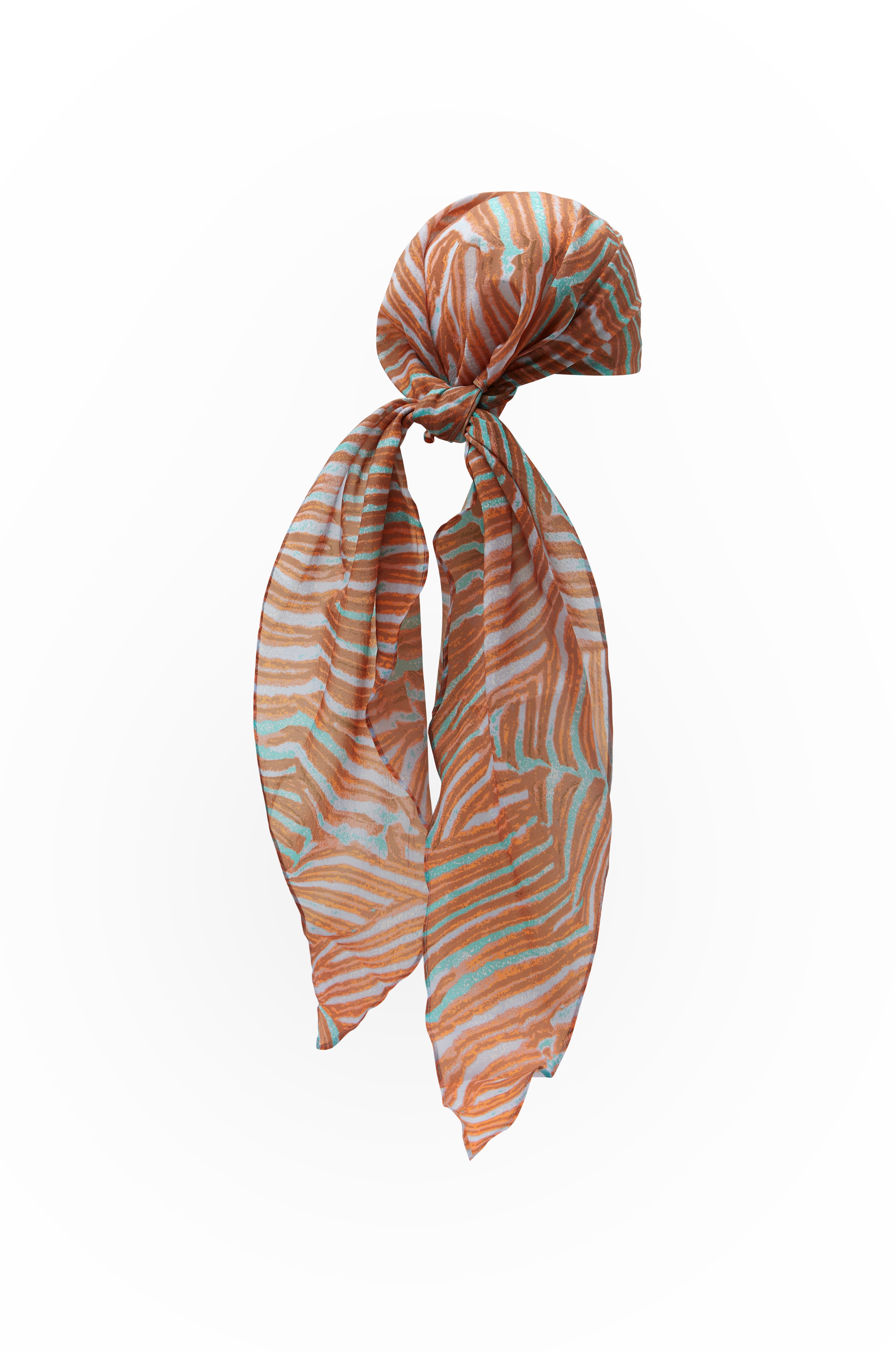Coral print headscarf with orange and teal pattern on a white background