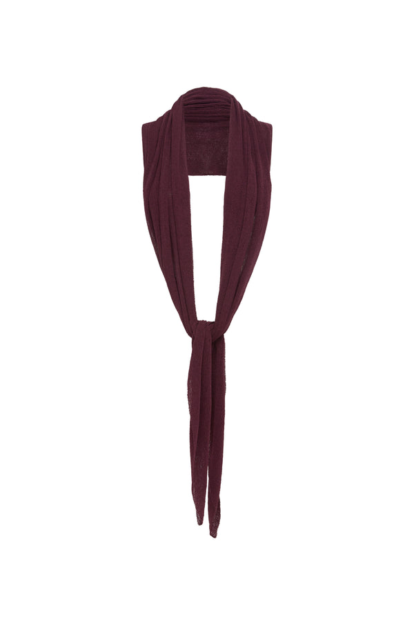 A burgundy knit draped top over a mannequin neck against a plain white background.