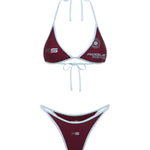 Deep purple bikini set with baby blue trim, photographed on a white background.